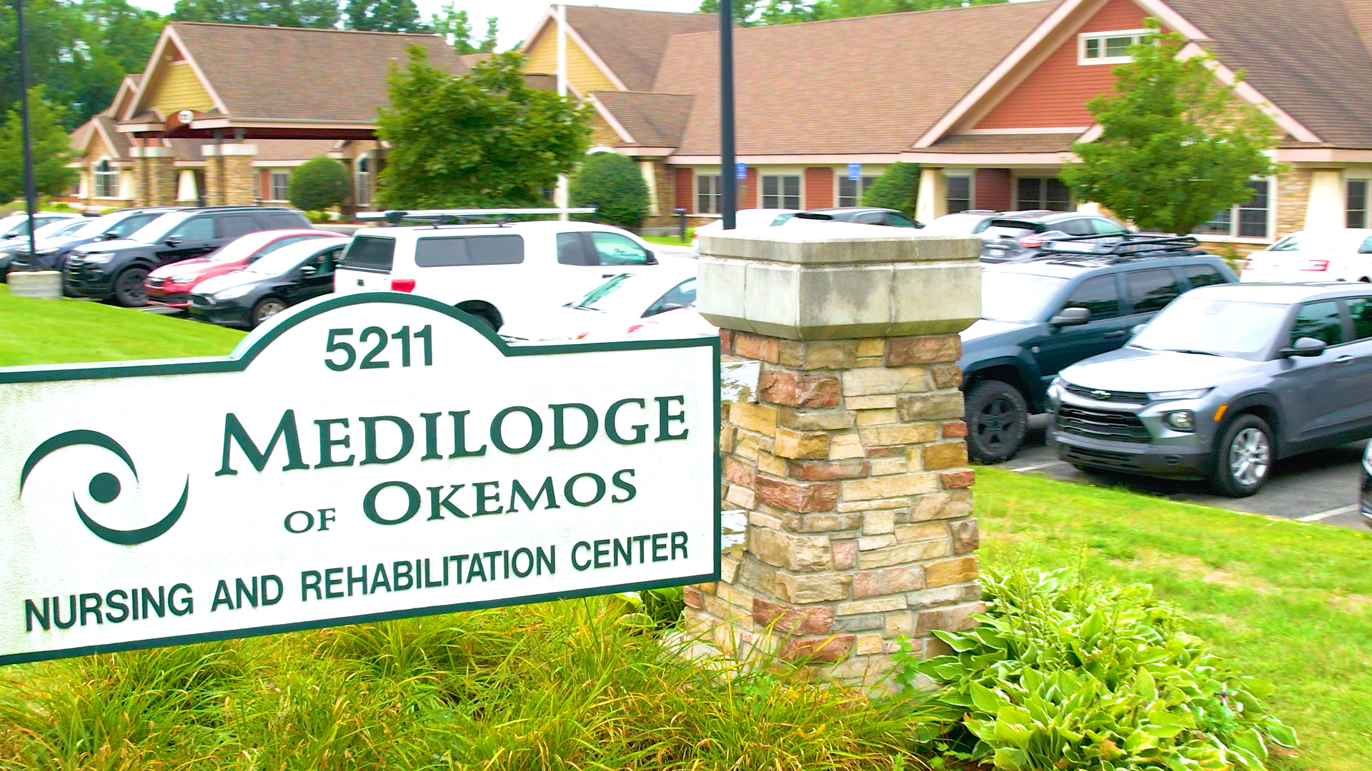 Medilodge of Okemos Sign in front of the building.